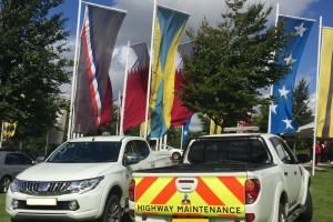 Two highway maintenance vehicles parked