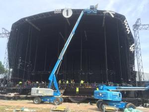 A crane erecting a stage
