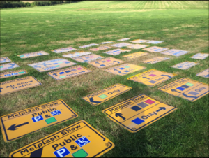 Road signs laid out in a field