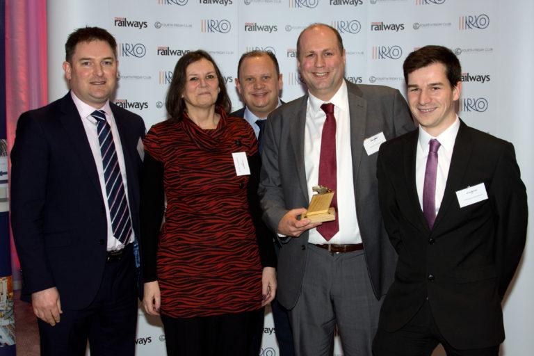 Tracsis CEO Chris Barnes presents the Golden Whistle to c2c