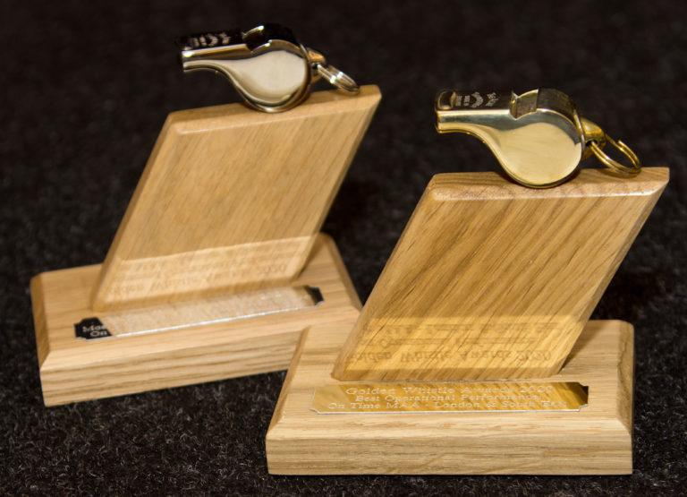 Two Golden Whistle trophies