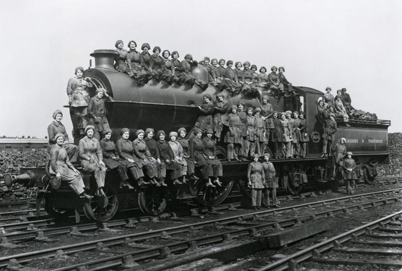 a group of women on a steam train