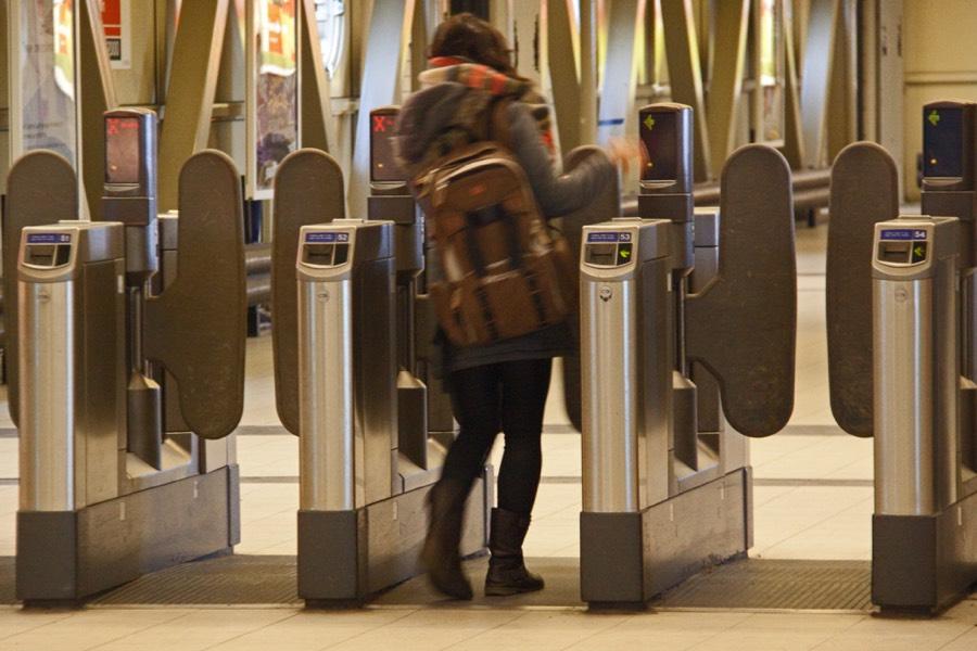 Passenger using a ticketless turnstile