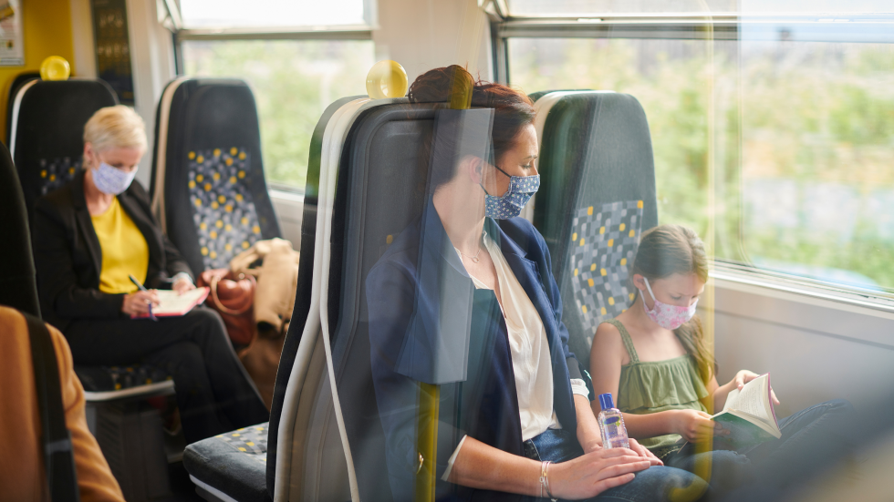 Mum and child inside of a train