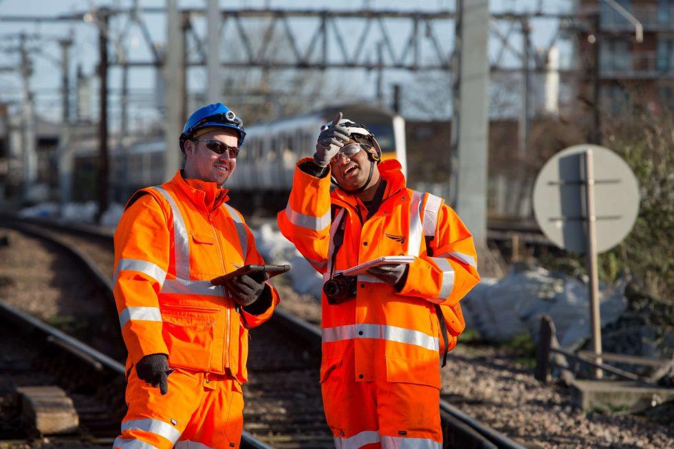 two rail workers on a rail track