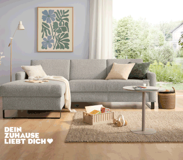 Schlafsofa mit Bettkasten in hellgrauem Soff.