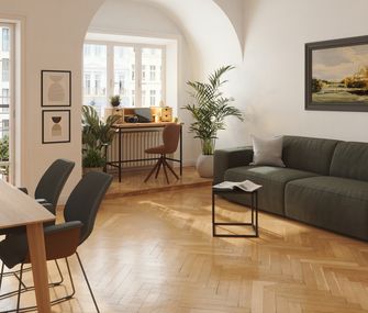 Loft mit olvigrünem Sofa, schwarzen Möbeln und einem weiß-grau-schwarzen Teppich
