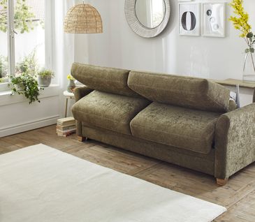Dunkelgrünes Schlafsofa von NATURA HOME mit Auszieh-Funktion zum Schlafen