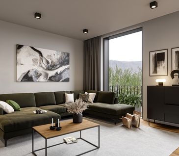 Dunkelgrüne Wohnlandschaft mit beigem Teppich, kleinem Holz-Couchtisch und schwarzem Highboard in hellem Wohnzimmer.