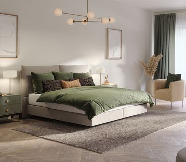 Beiges Bett mit olivgrüner Bettwäsche in hellem Schlafzimmer.