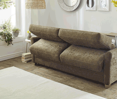 Grünes Schlafsofa, bei dem komplette Matratze ausgeklappt werden kann