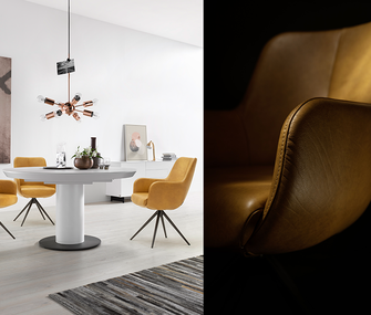 Gelbe Lederstühle um einen weißen Esstisch