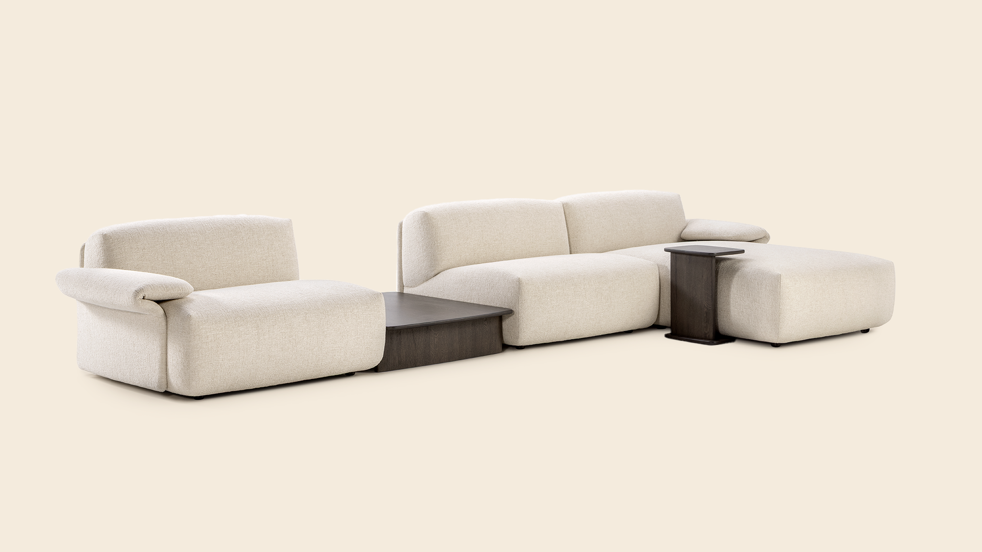 Modern beige sectional sofa with wooden side tables, combining comfort and functionality, set against a light beige background.