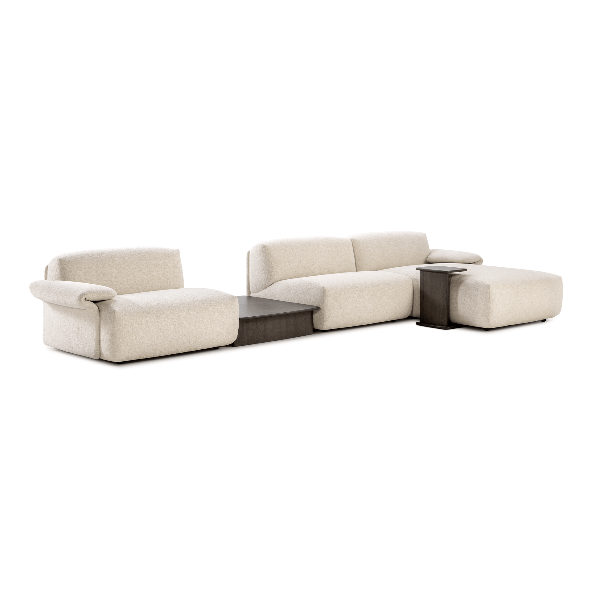 Modern beige sectional sofa with plush cushions, featuring dark wood side and central tables, arranged in a spacious layout.