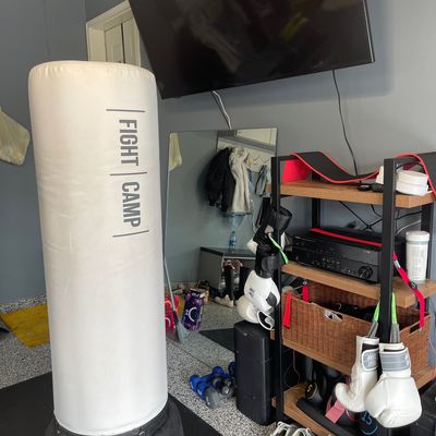 FightCamp bag in room with TV and boxing gloves