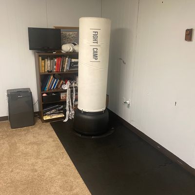 FightCamp bag in living room with floor mats