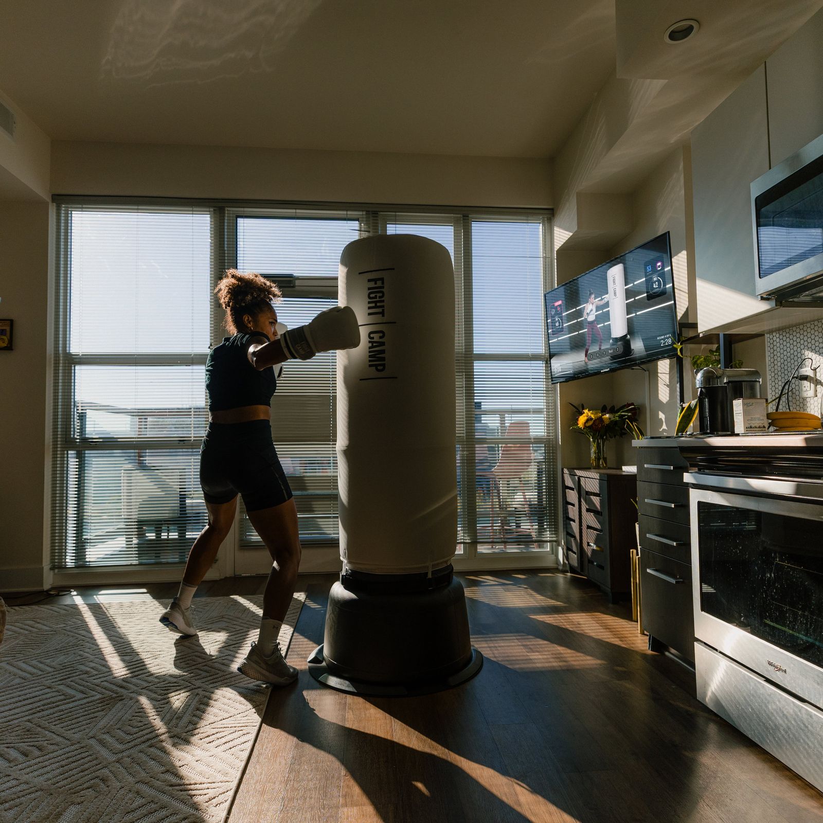 FightCamp user punching free standing bag