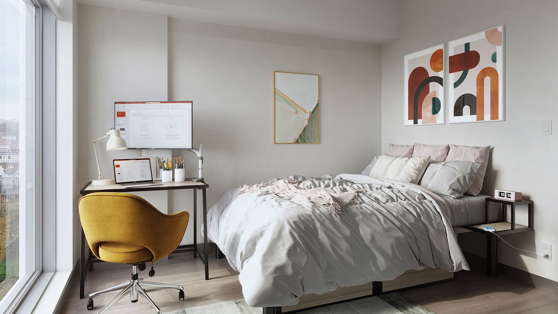 Apartment bedroom with a bed and desk at the Quad at York apartments