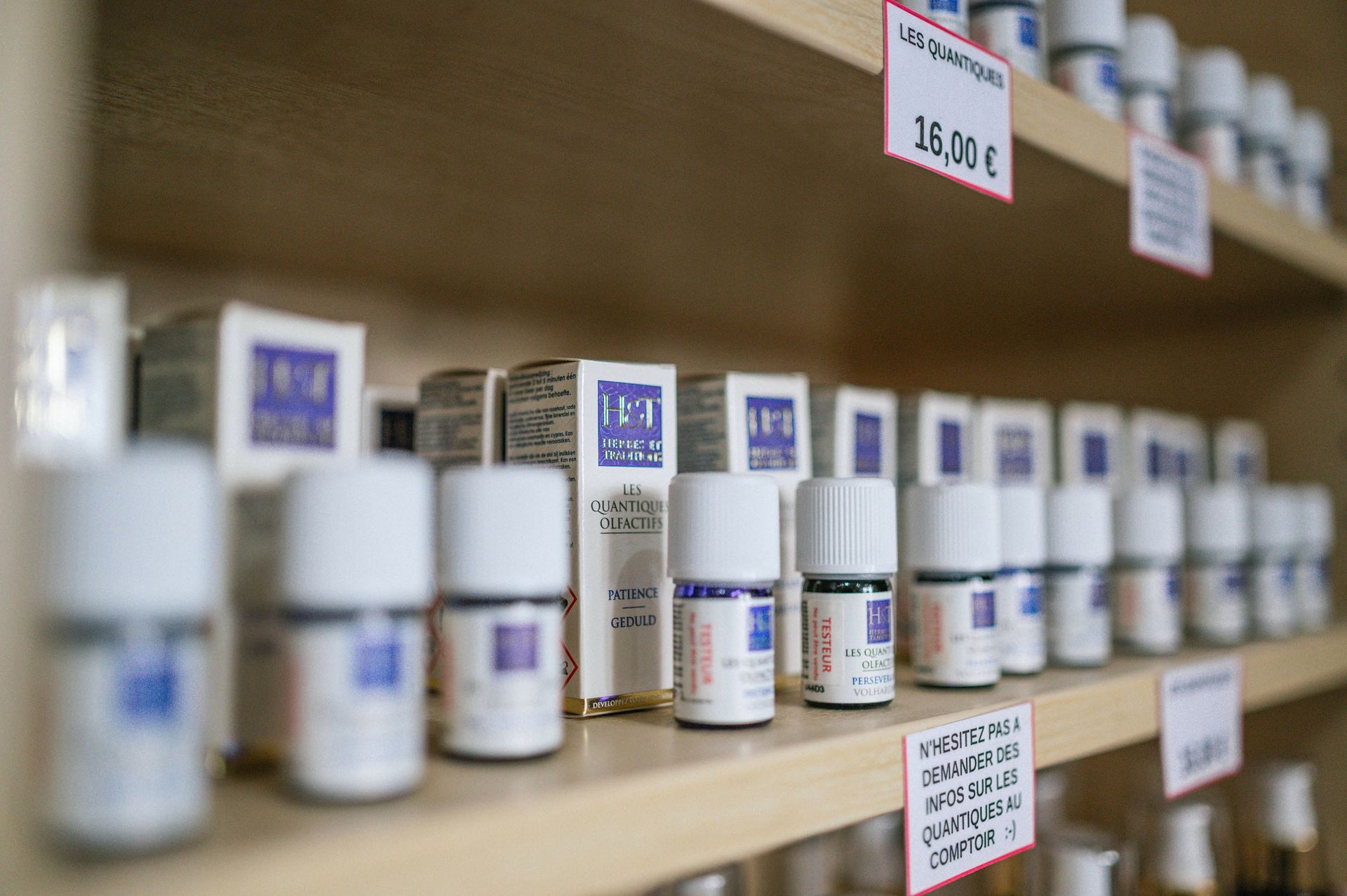 A pharmacy shelf is shown full of prescription drugs, placed in an organized manner