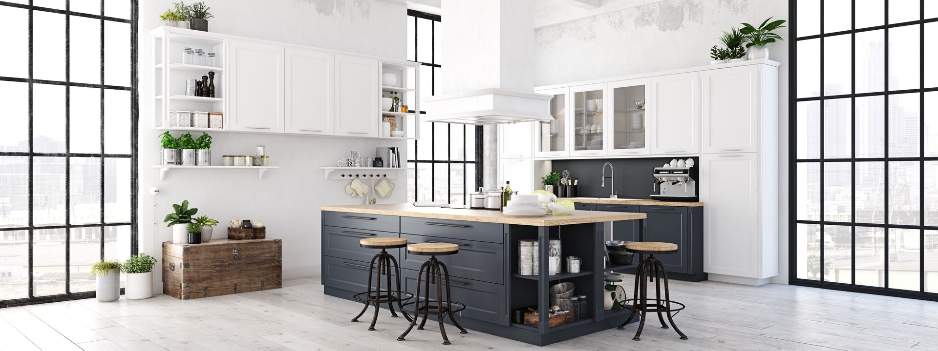 A naturally well-lit kitchen with modern finishes, white walls, and a mixture of black and white cabinets