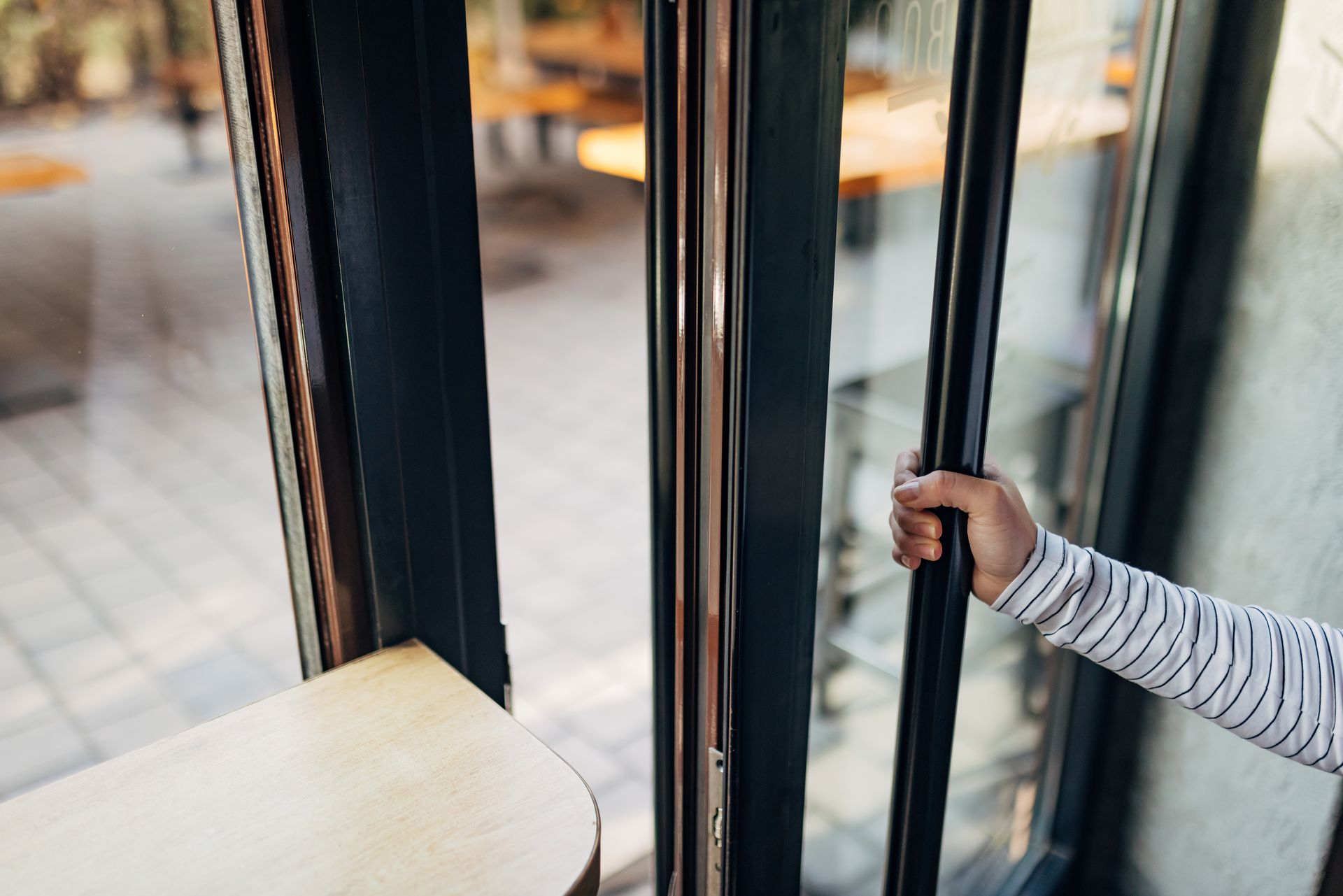 Waitress Opens Door Istock 1446081427