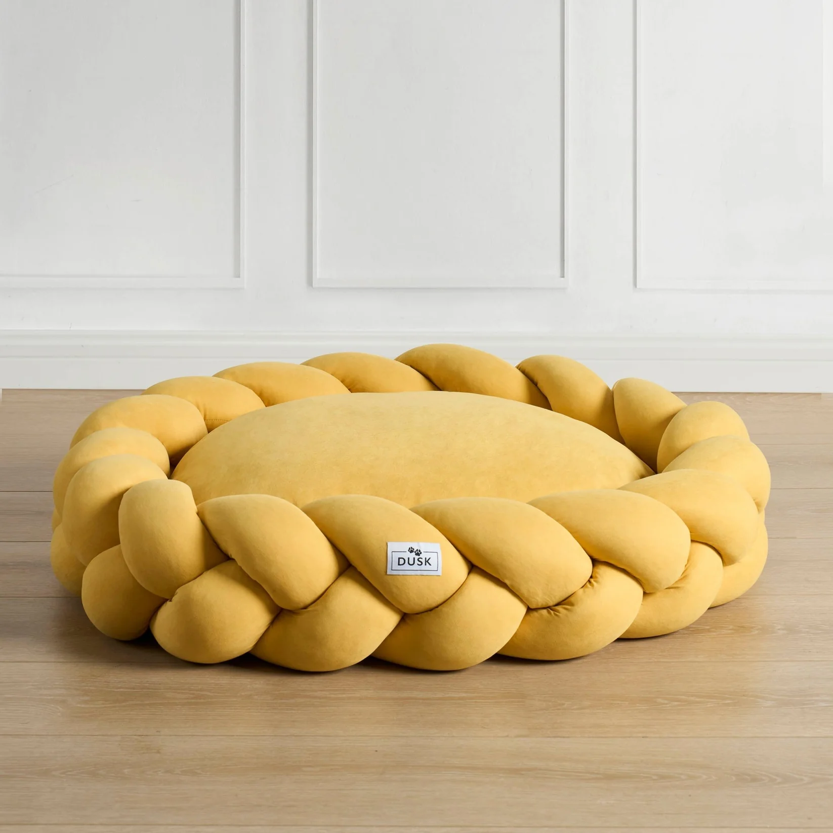 Image of a yellow plait dog bed
