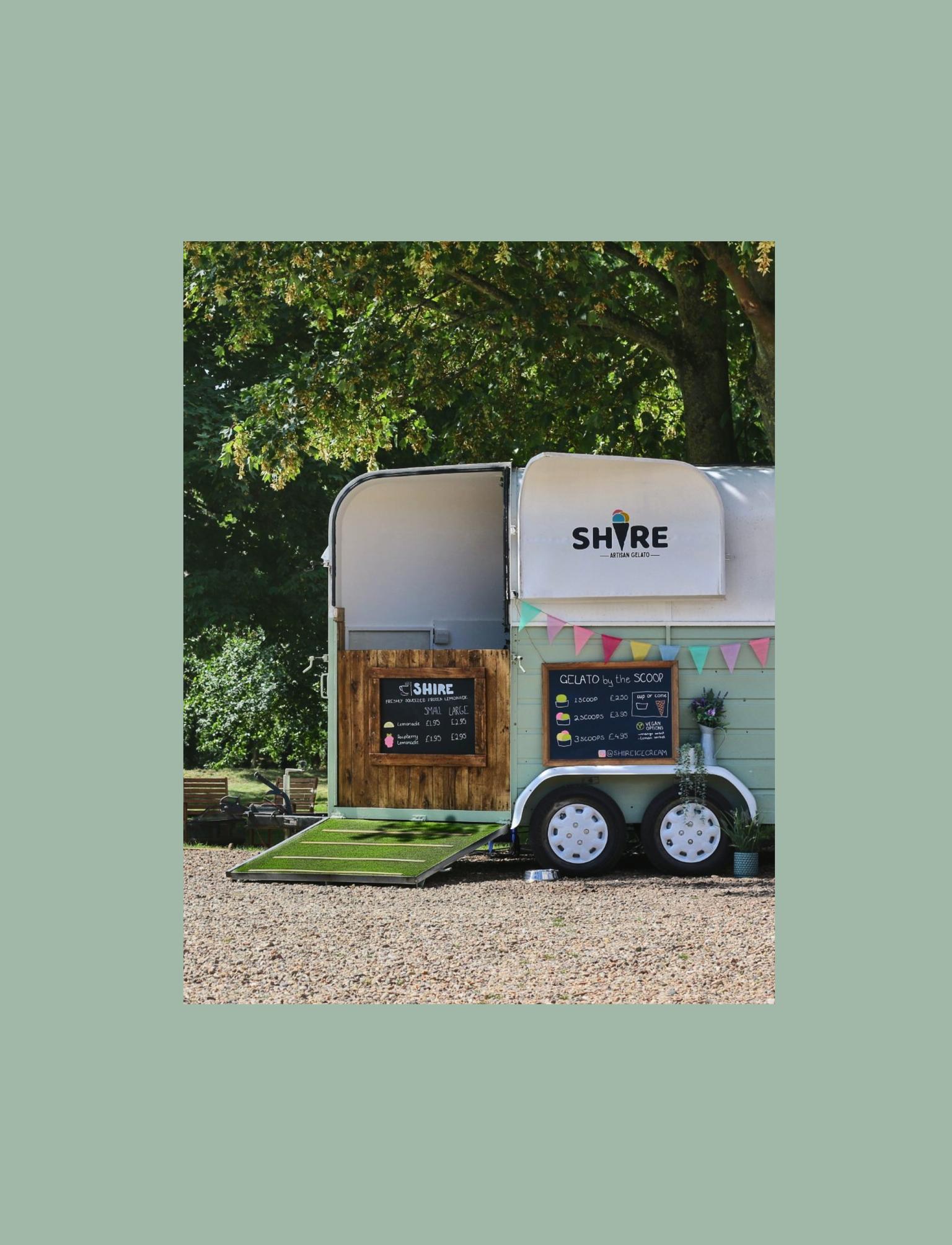 A picturesque county scene with a horse trailer converted into an ice-cream stall.