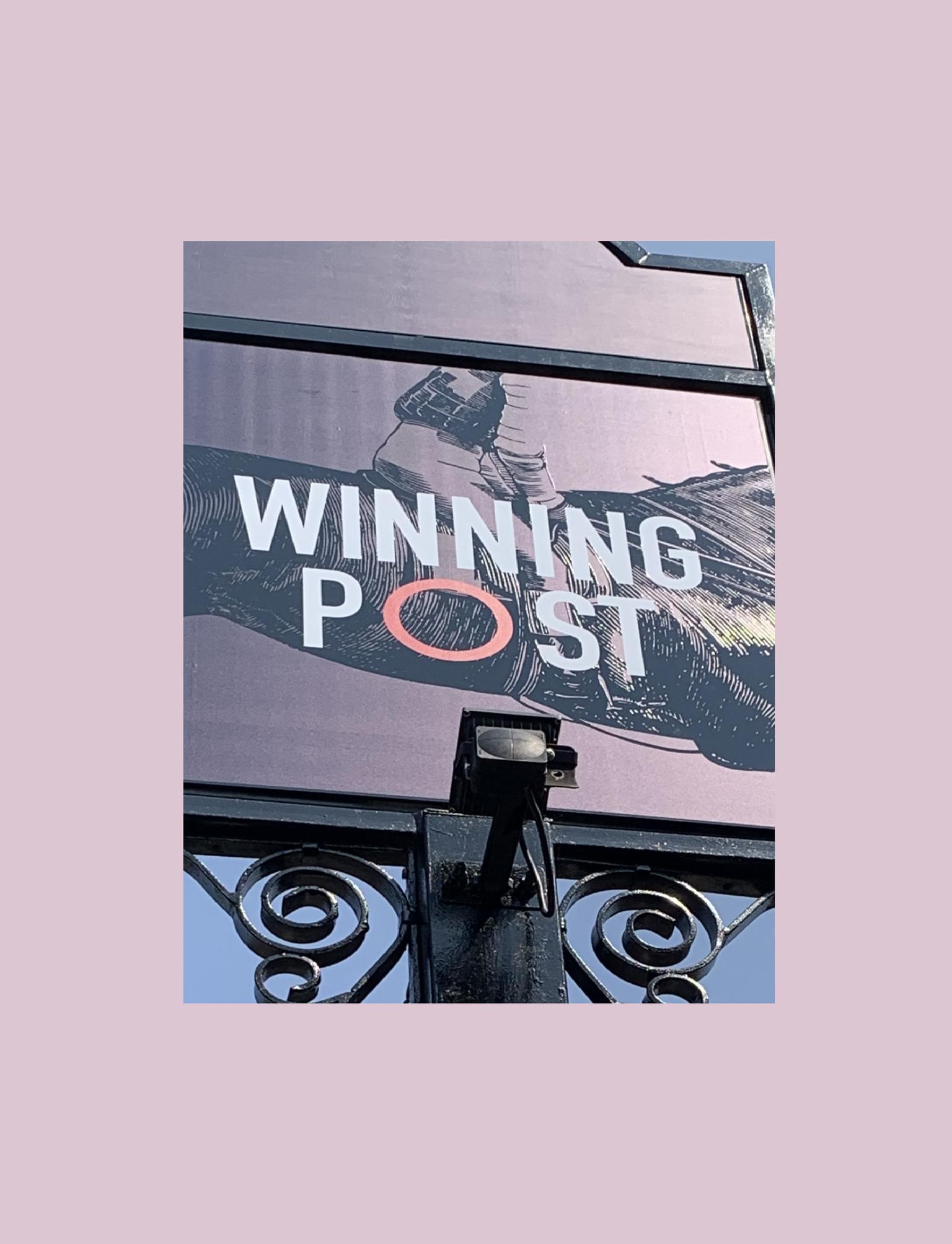 Pub sign that says 'winning post'.