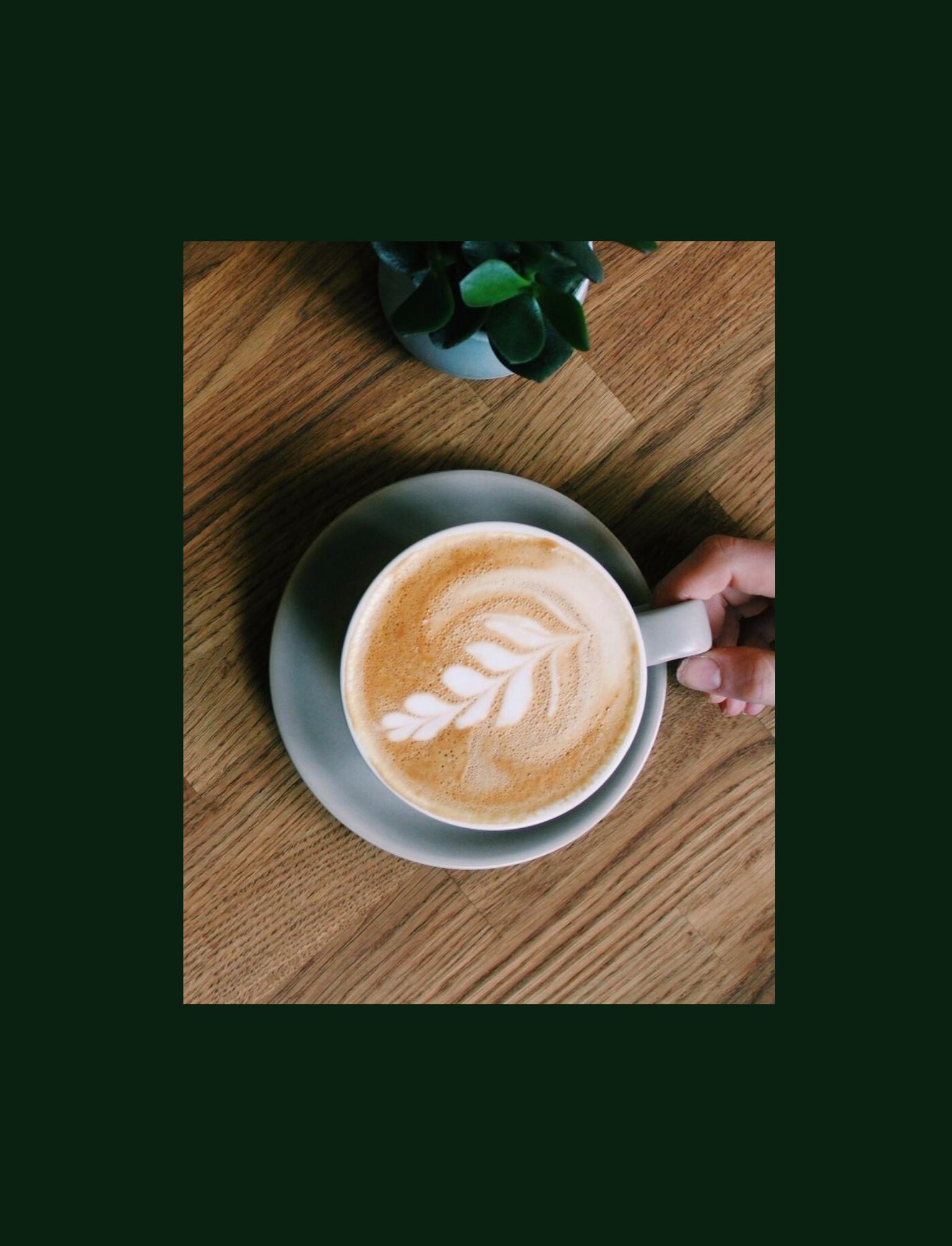 Top down view of someone grabbing a coffee and another person pouring a tea.