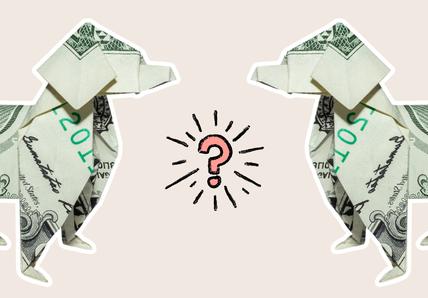 Two paper maché dogs made out of dollar bills facing each other with a pink question mark in between them