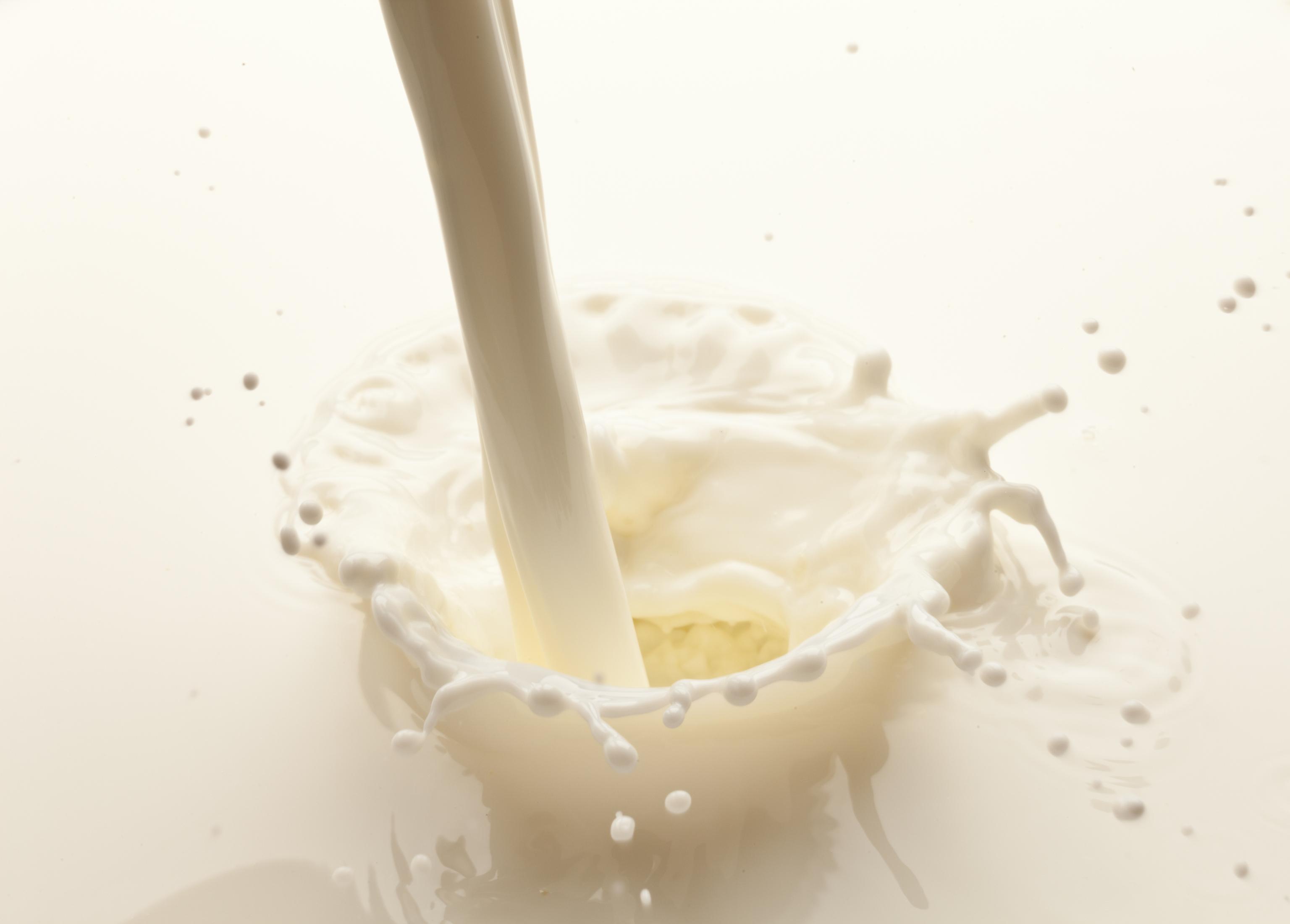 A close-up of milk being poured