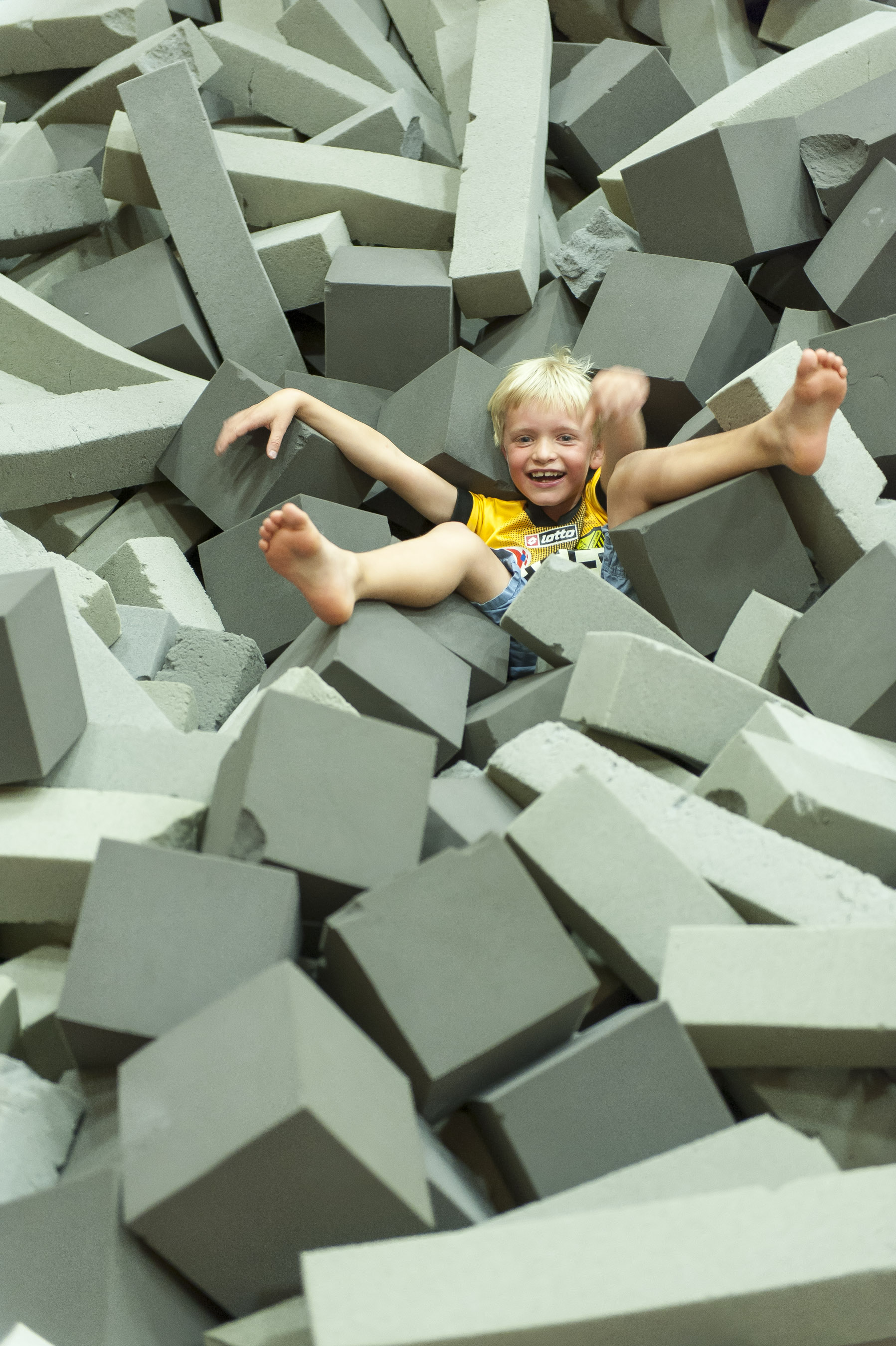 boy in gymnastics foam pit