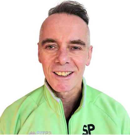 headshot of simon smiling at camera