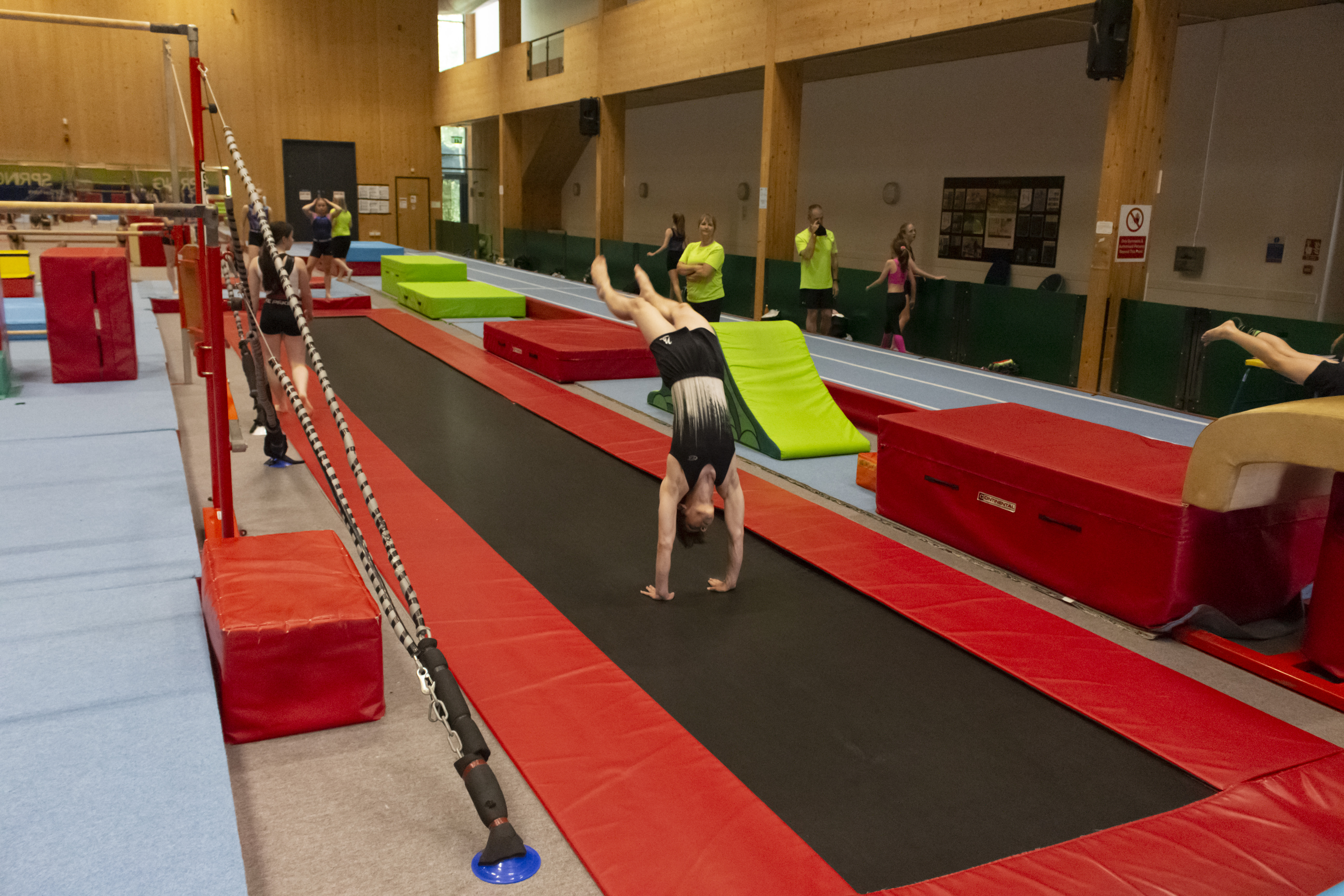 Boy doing back handspring.