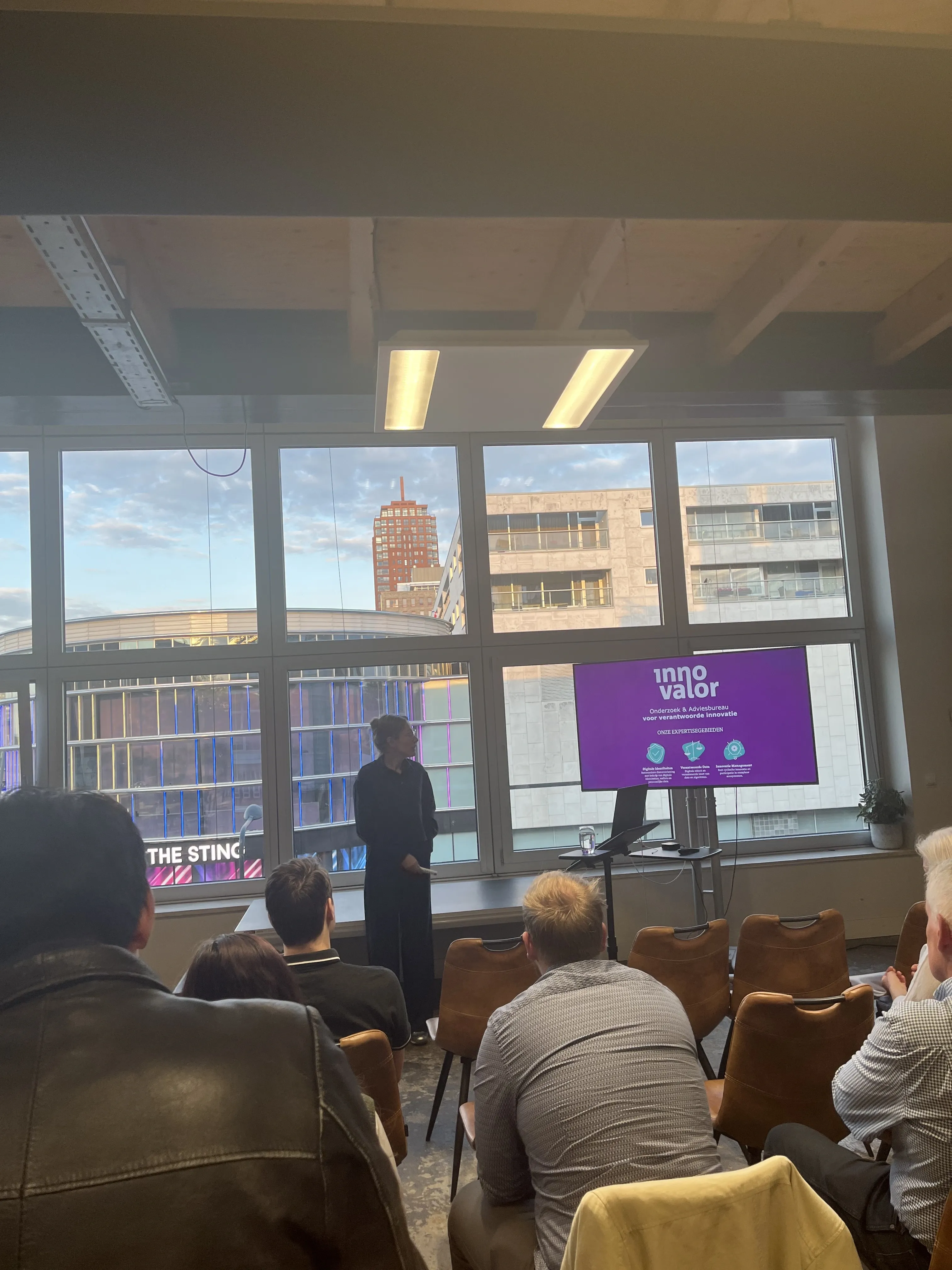 Audience listening and watching to one of the speakers at the digitalization in the public sector meetup