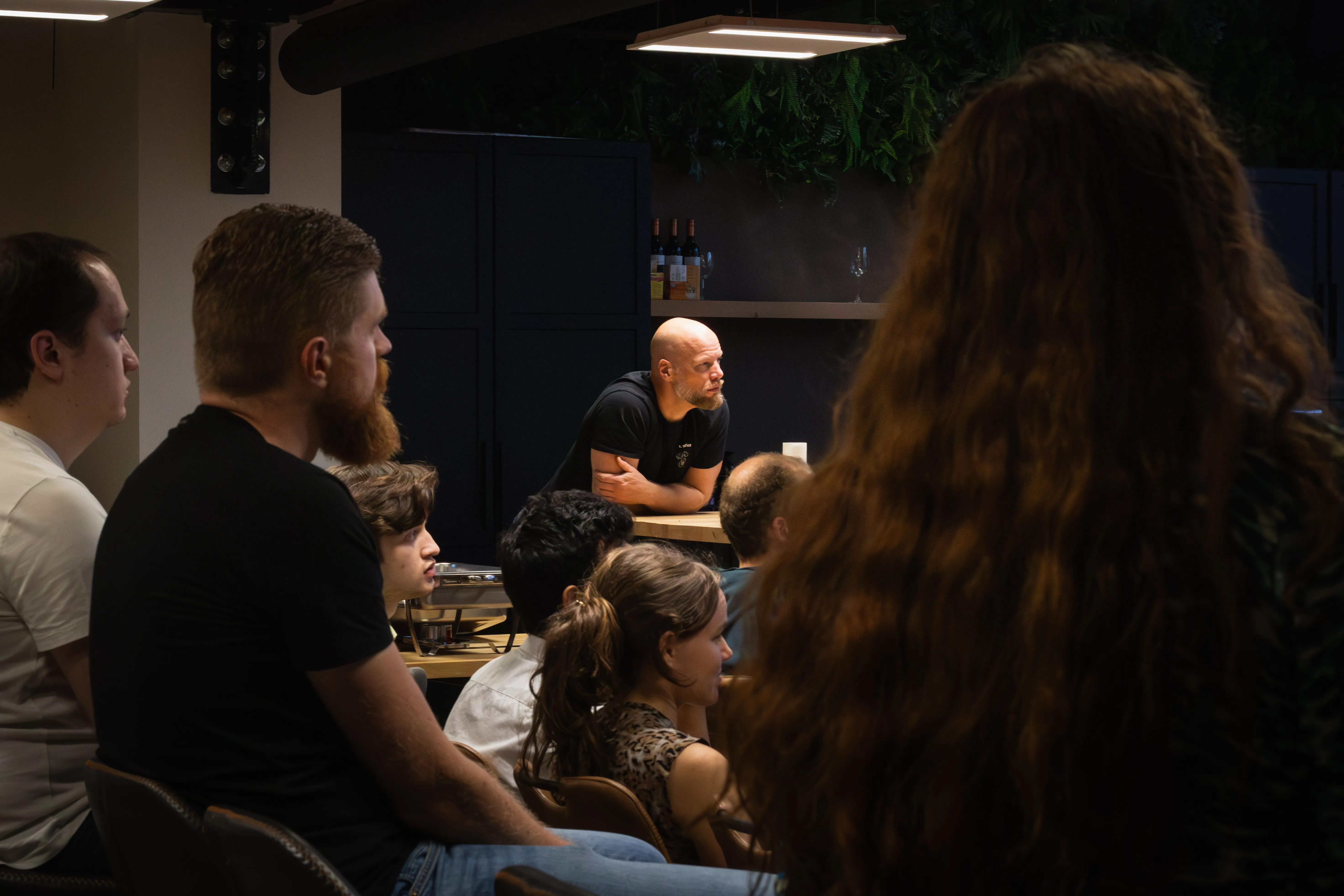 Audience listening and looking at the speaker during the web development meetup