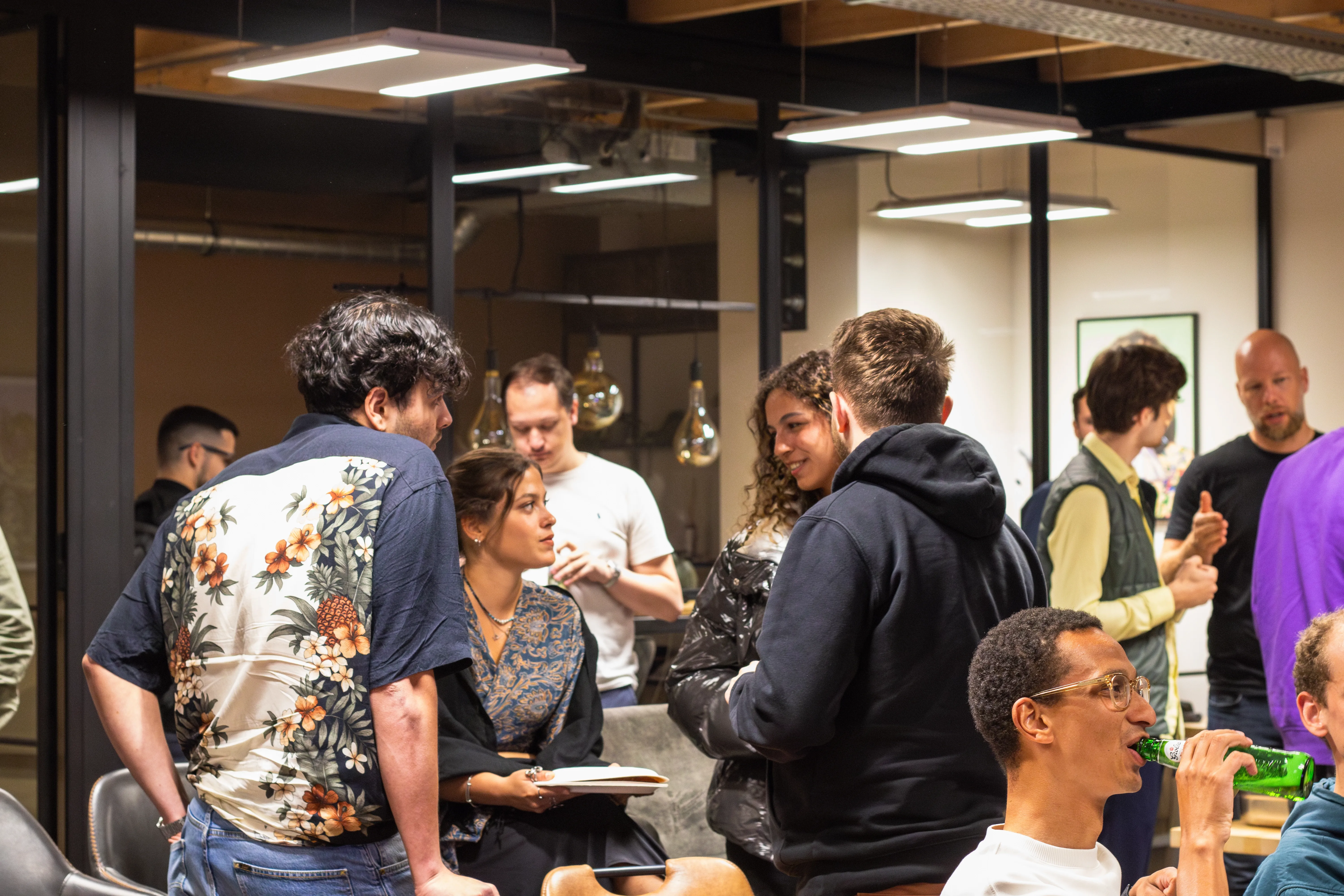People standing and chatting after the web development meetup