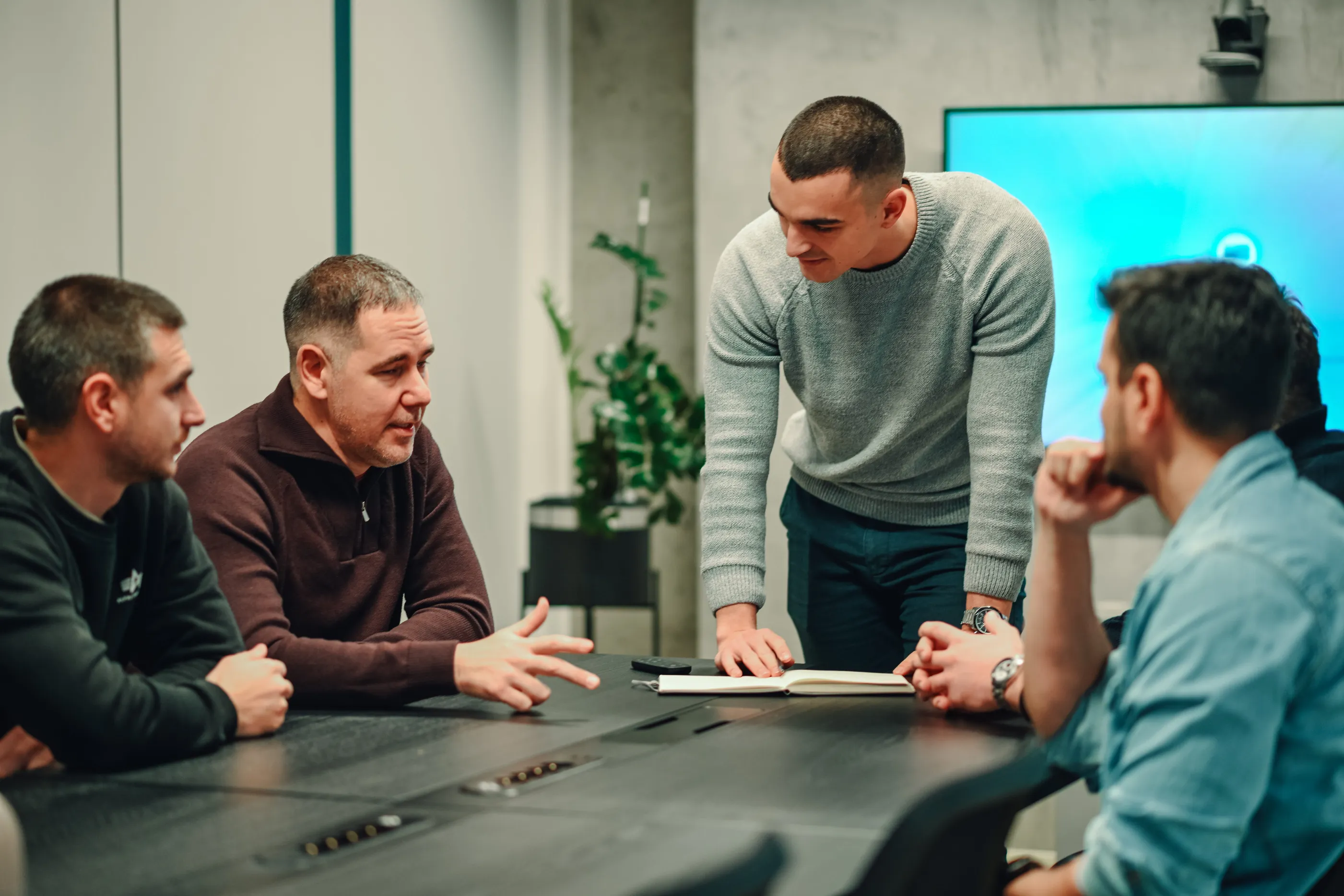 two people explaining graphs on blackboard