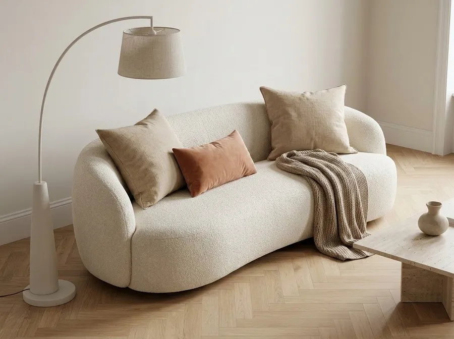 Ivory bouclé sofa in a bright living room