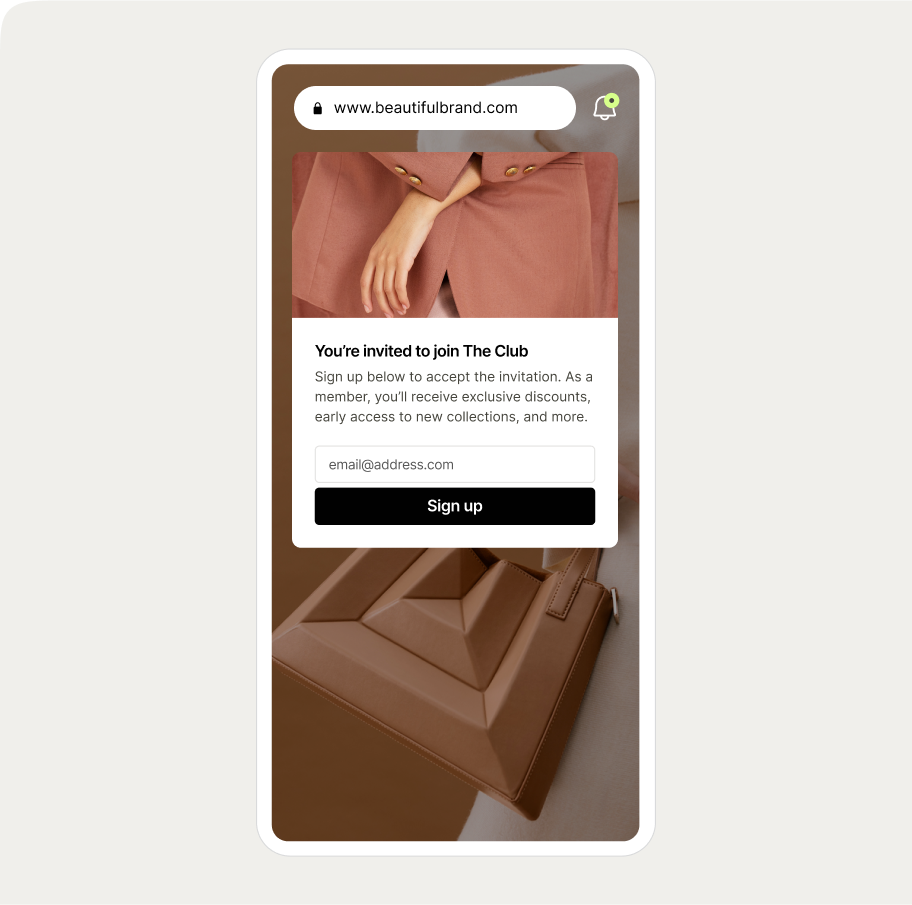 Smartphone screen displaying a Wisepops feed notification with a sign-up invitation with a brown handbag and a person in a pink suit in the background.
