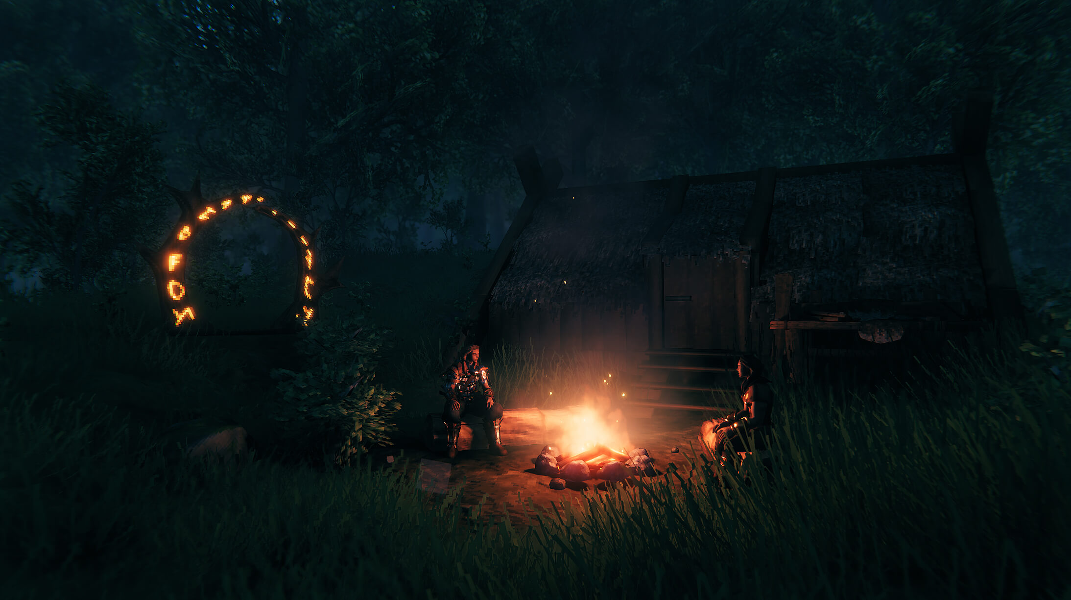 Starter camp in Valheim with a fire and portal used to prepare a safe base before early bosses