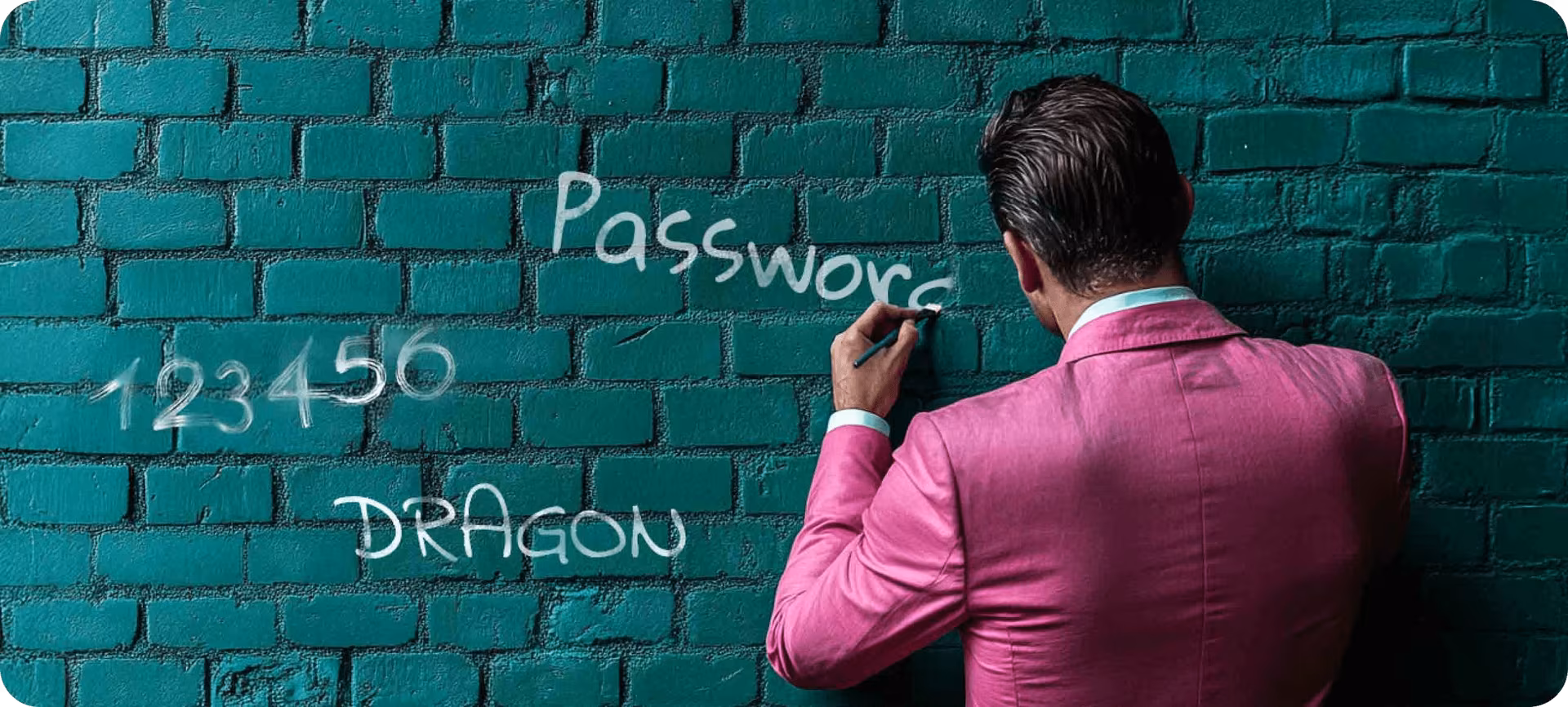 man writing passwords on the wall