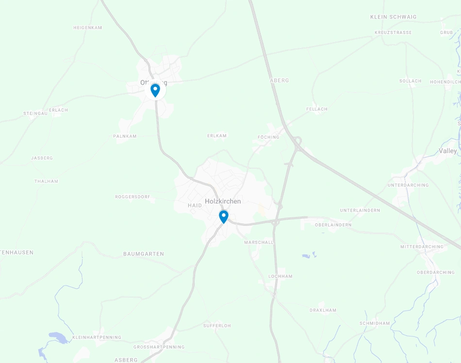Karte mit Holzkirchen und Otterfing mit Markierungen, umgeben von Straßen und Grünflächen. Nahegelegene Orte sind beschriftet.
