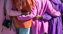 Group of ladies in purple showing how remote work strengthens diversity and inclusion