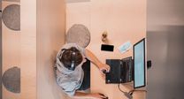 Man in headphones running startup payroll