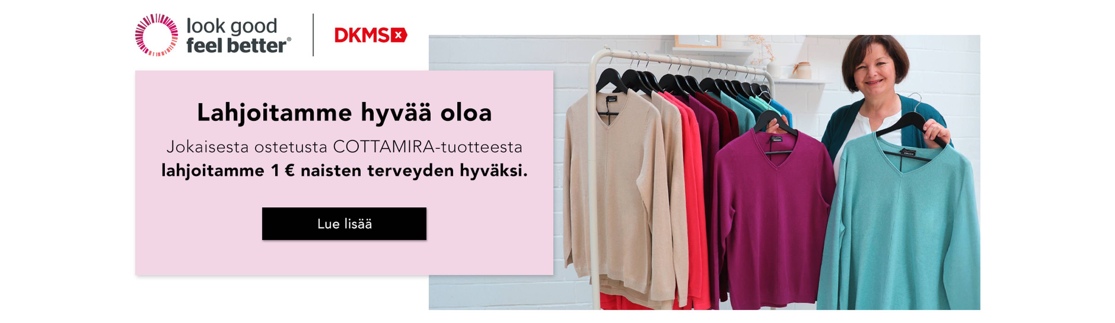Nainen seisoo vaateripustimen vieressä, jossa on värikkäitä villapaitoja, ja mainostaa naisten terveyttä edistävää hyväntekeväisyysaloitetta.