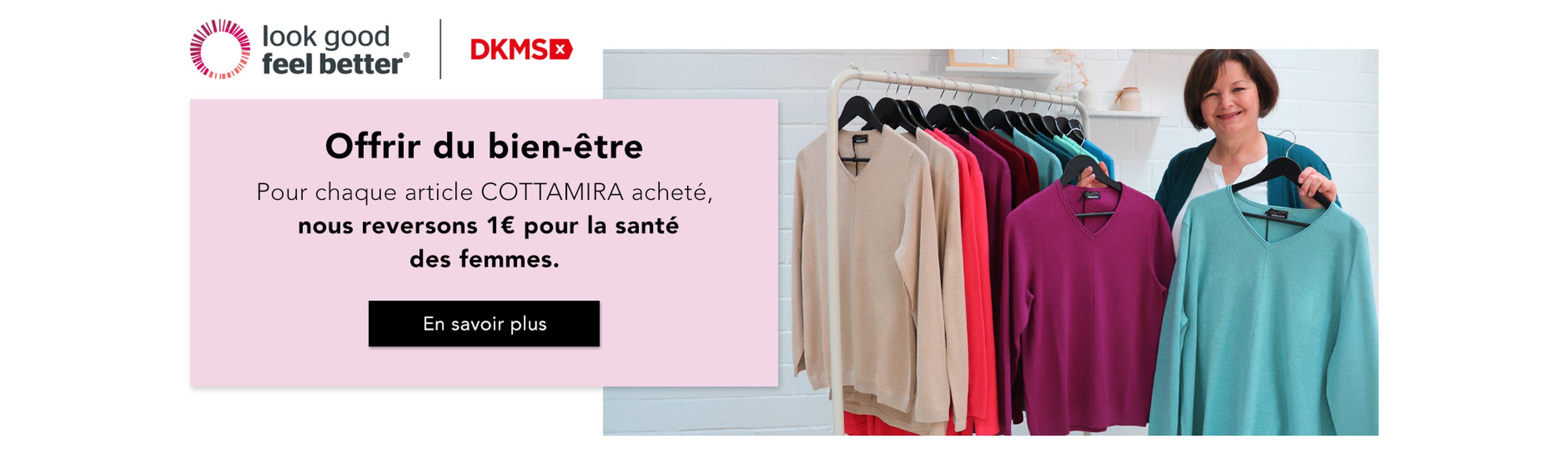 Une femme se tient à côté d'un portemanteau sur lequel sont accrochés des pulls colorés et fait la promotion d'une initiative caritative en faveur de la santé des femmes.