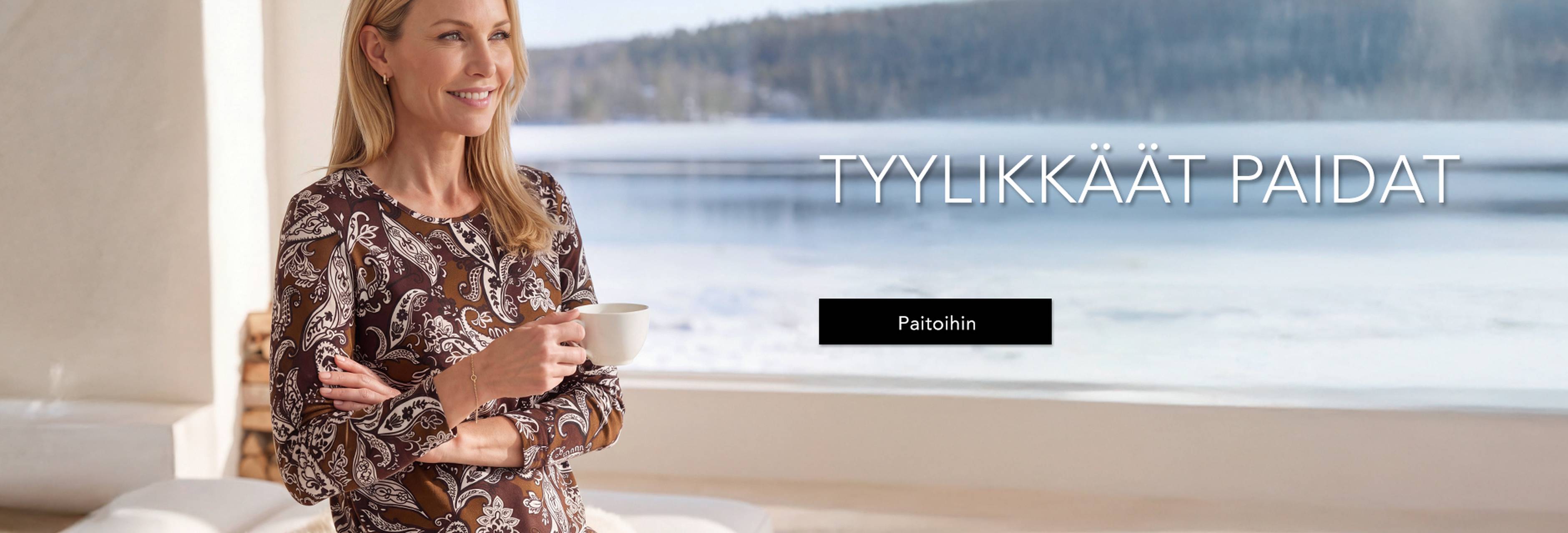 Tyylikkäässä yläosassa oleva nainen nauttii kahvia lumisen maiseman äärellä. Teksti: ”Tyylikkäät paidat”.