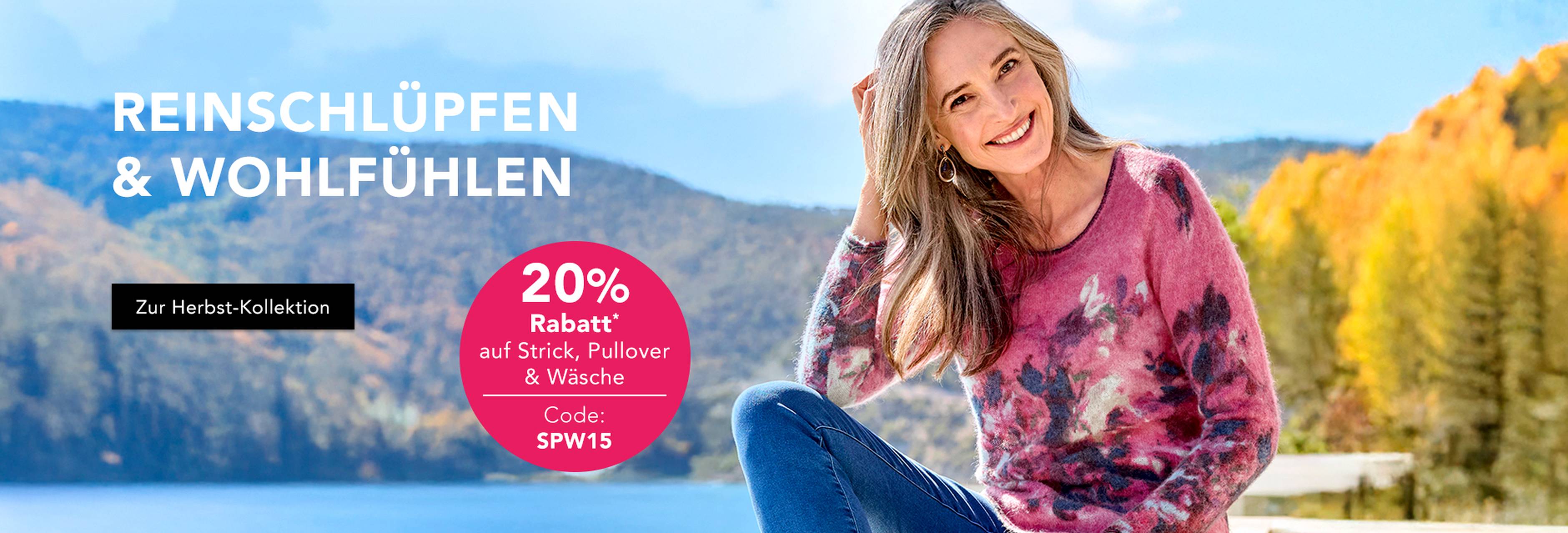 Frau in pinkem Blumenpullover sitzt im Herbst am See, 20 % Rabatt auf Strickmode
