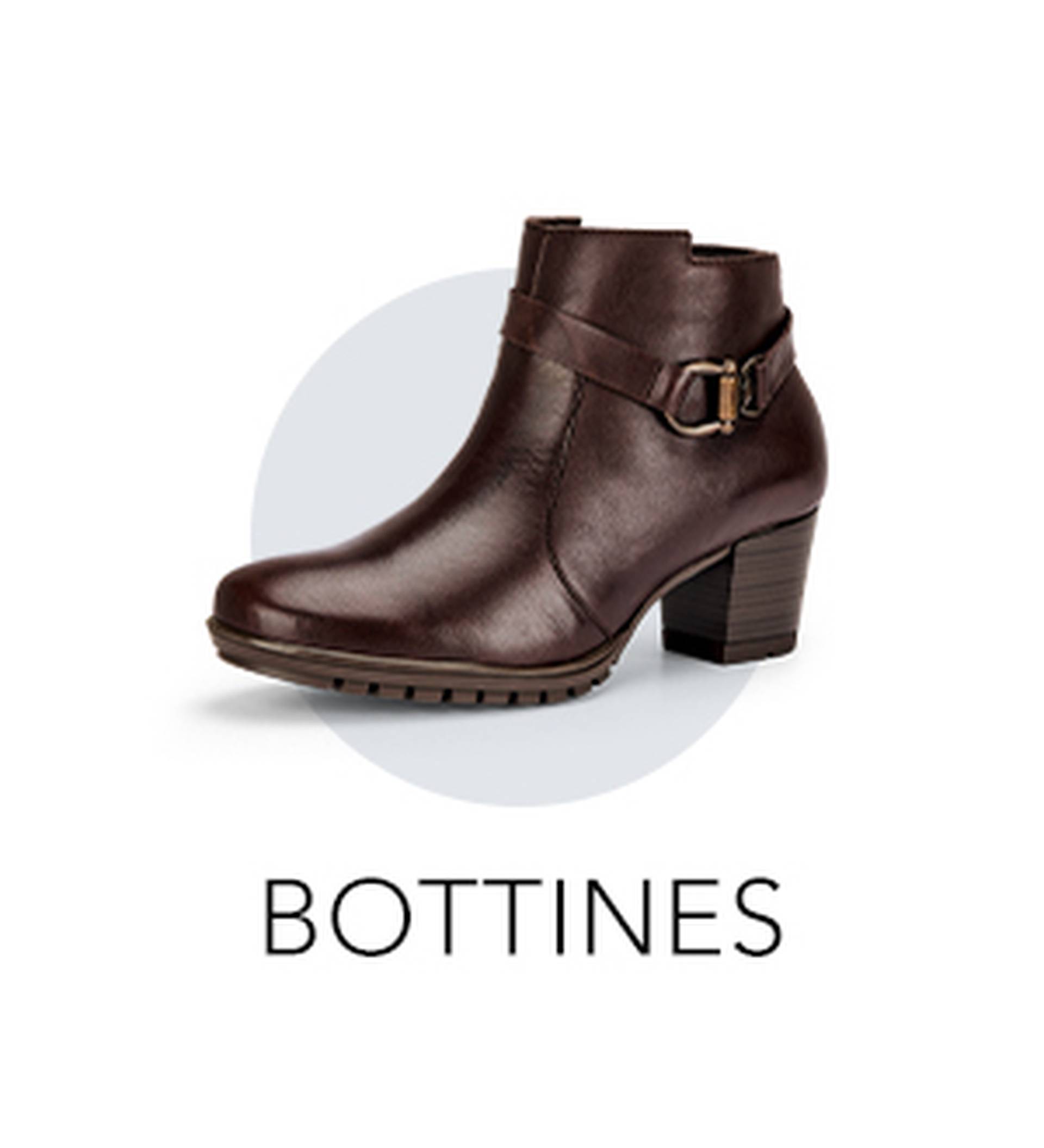 Élégante bottine en cuir marron à talon bas, agrémentée d'une lanière noir et or, issue de la collection de bottines confortables de la marque GOLDNER.
